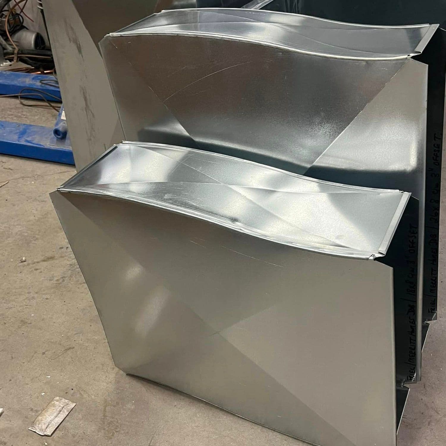 A galvanized duct boot with a rectangular opening