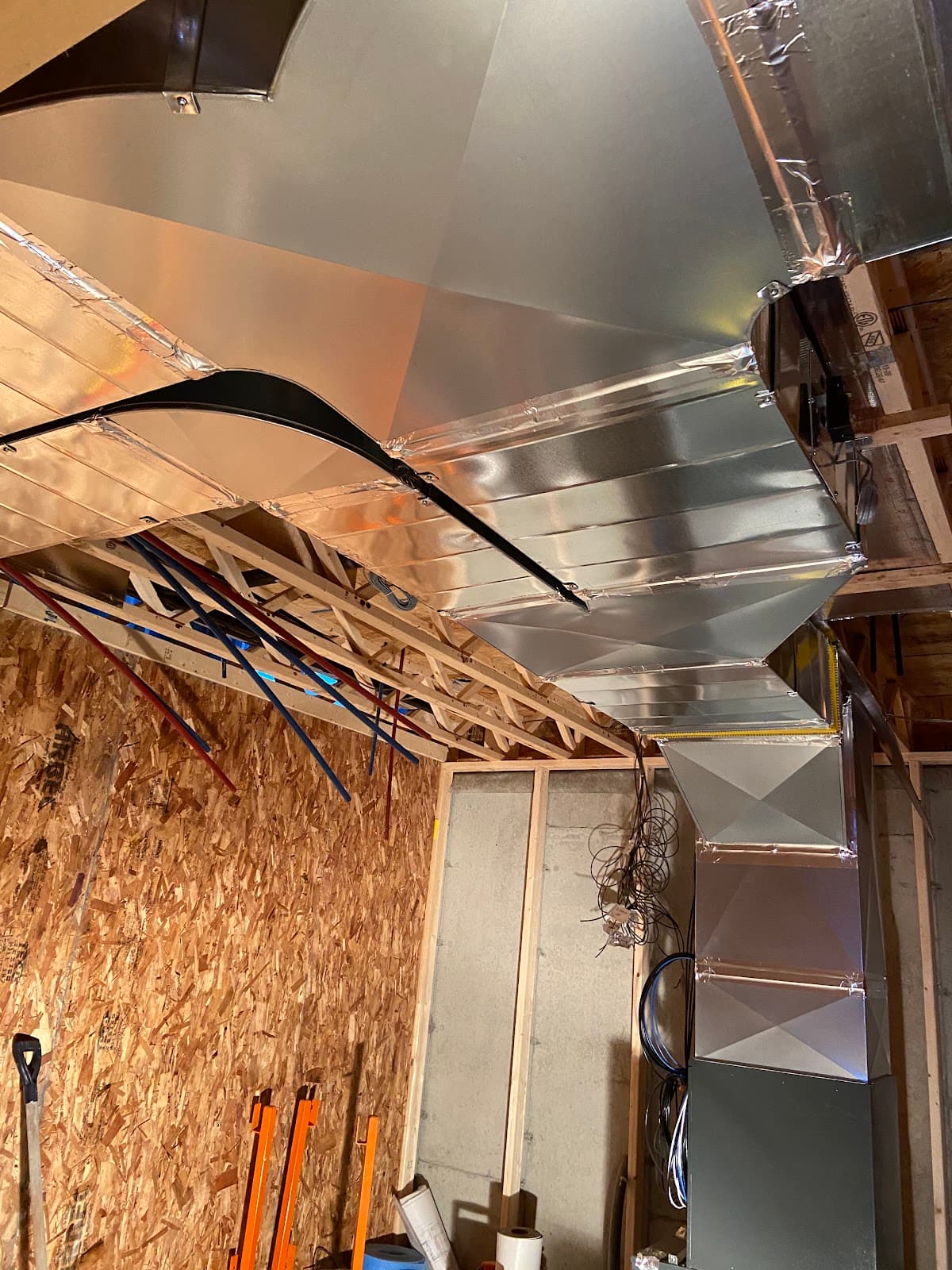 Custom ductwork installed between floor joists