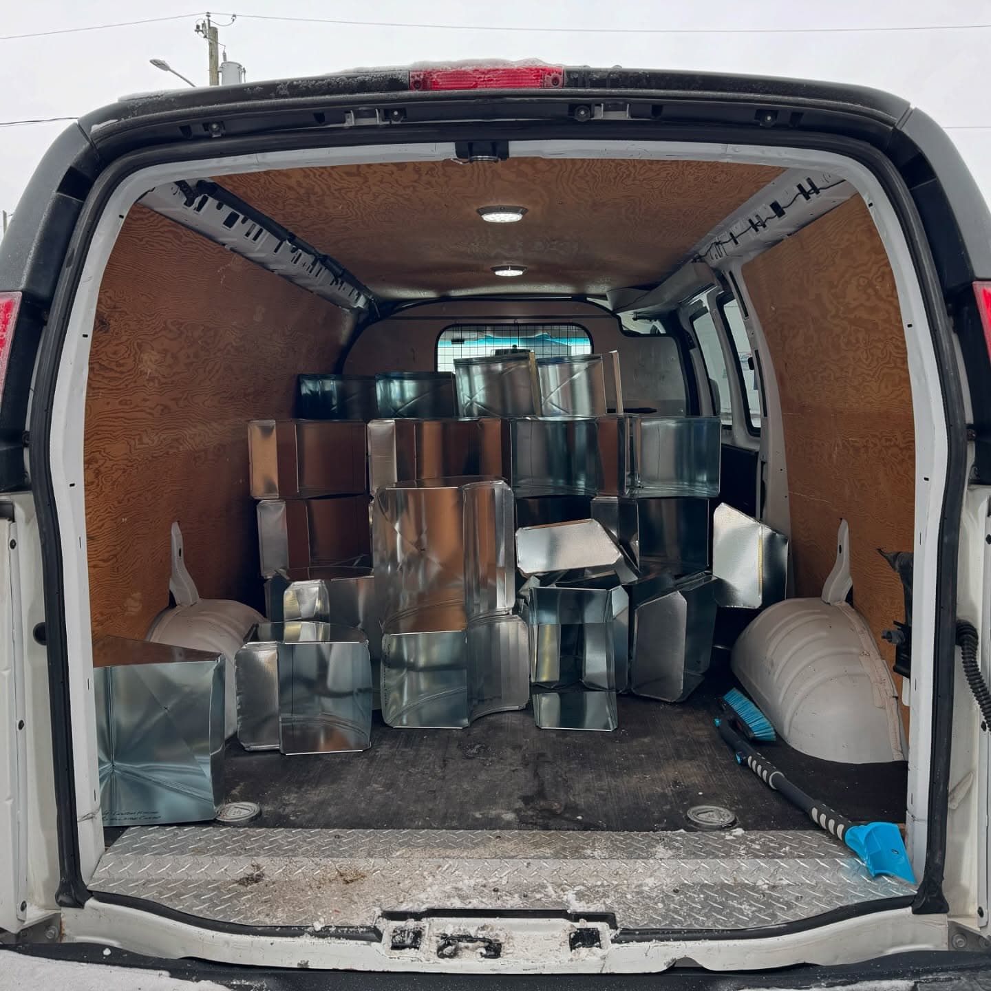The back of the van loaded with fittings for delivery